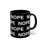 An 11oz black ceramic mug with a repeating white text pattern of 'NOPE' and a matching black handle facing right, shown on a clean white background.