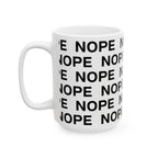 A 15 oz white ceramic mug printed with the word 'NOPE' repeated in bold black capital letters, shown on a clean white background.