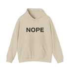 A sand beige pullover hoodie with the word 'NOPE' printed in bold black capital letters across the chest on a solid white background.
