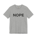 An athletic heather gray short-sleeve crewneck t-shirt with the word 'NOPE' printed in bold black capital letters across the chest, displayed on a clean white background.