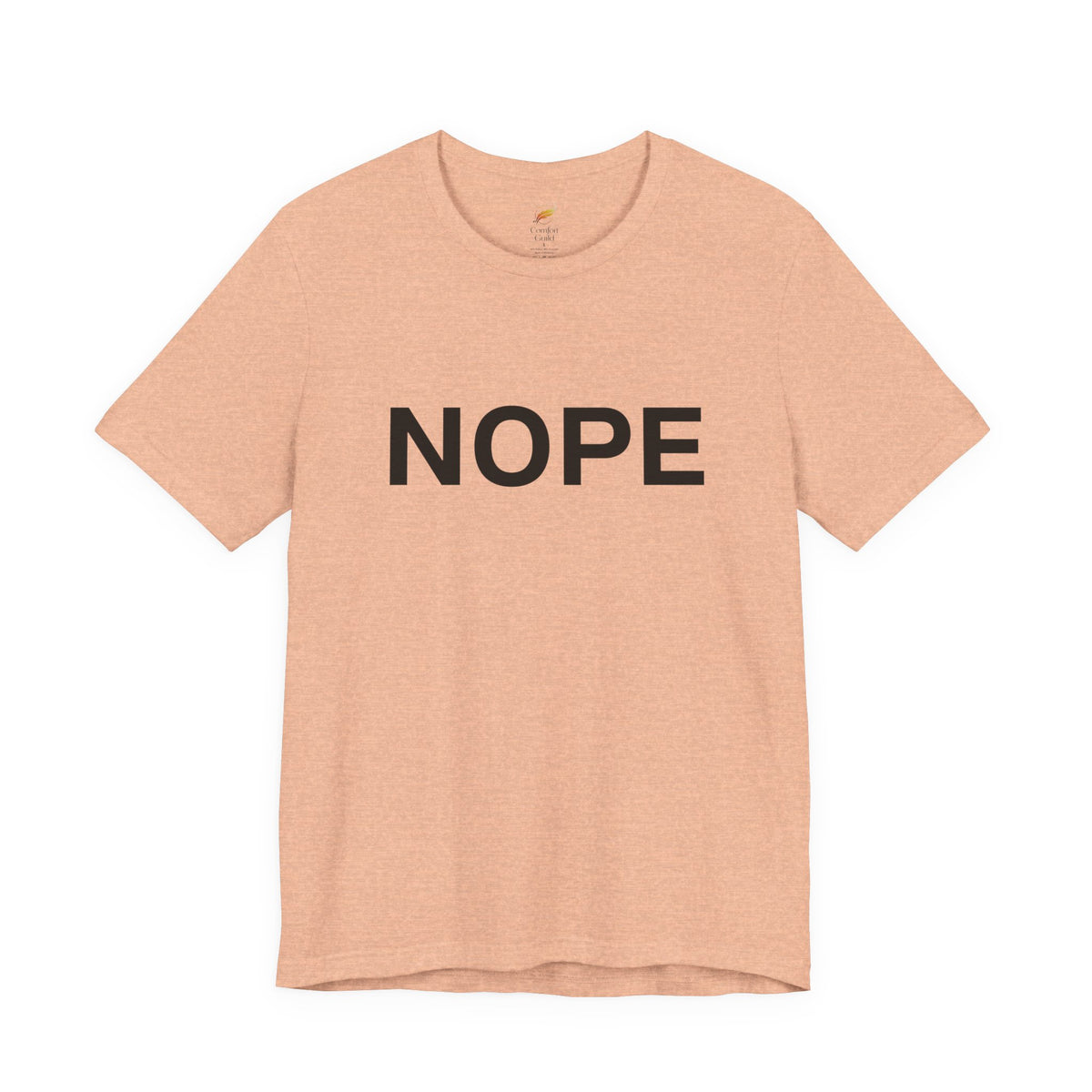 A heather peach short-sleeve crewneck t-shirt with the word 'NOPE' printed in bold black capital letters across the chest, displayed on a clean white background.