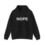 A black pullover hoodie with the word 'NOPE' printed in bold white capital letters across the chest on a solid white background.