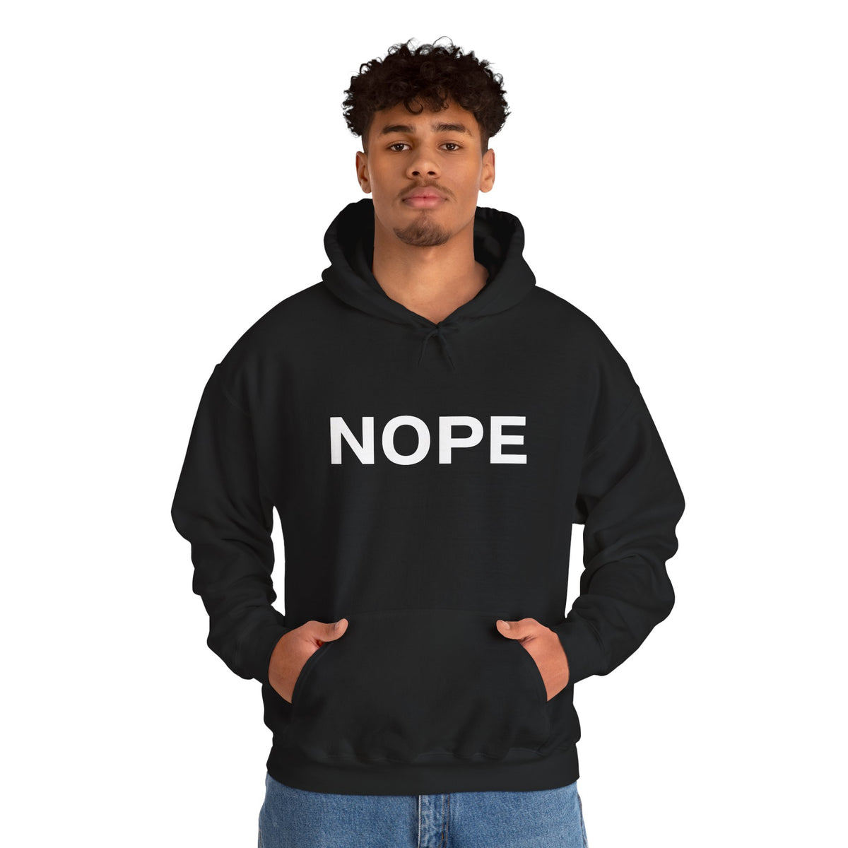 A man wearing a black pullover hoodie with a white bold graphic 'NOPE' design standing against a white background