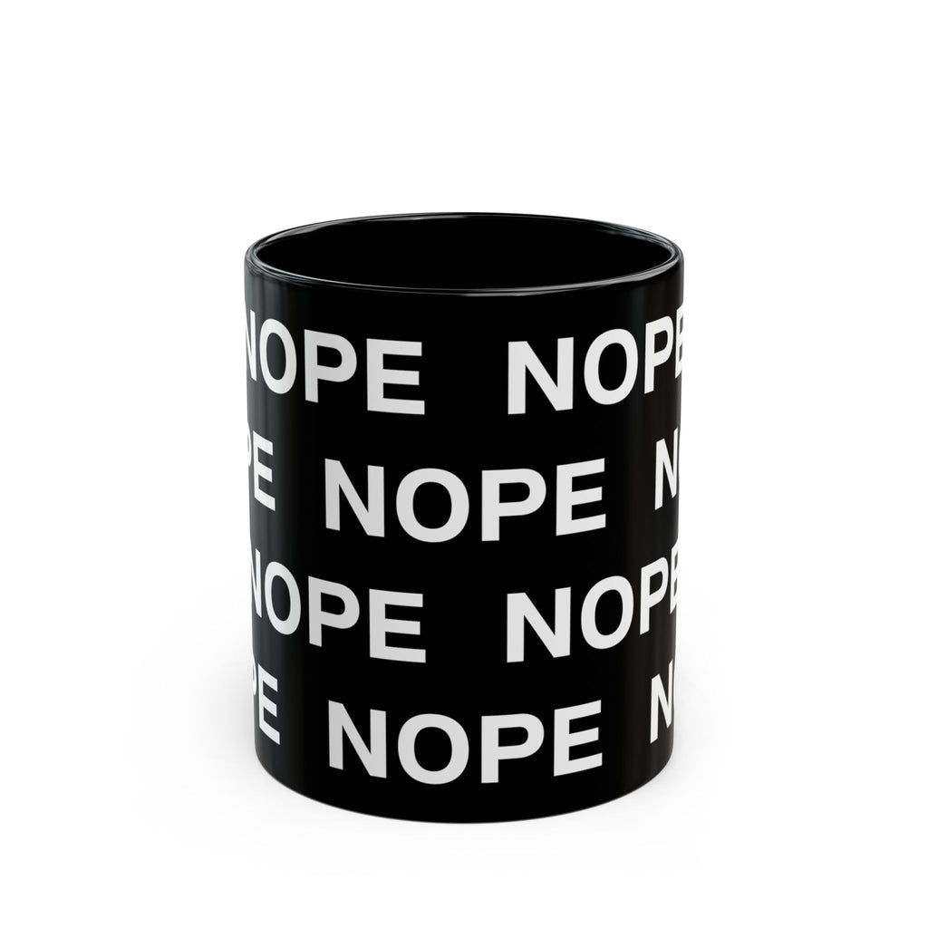 An 11oz black ceramic mug with a repeating white text pattern of 'NOPE' , shown on a clean white background.