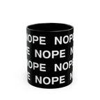 An 11oz black ceramic mug with a repeating white text pattern of 'NOPE' , shown on a clean white background.