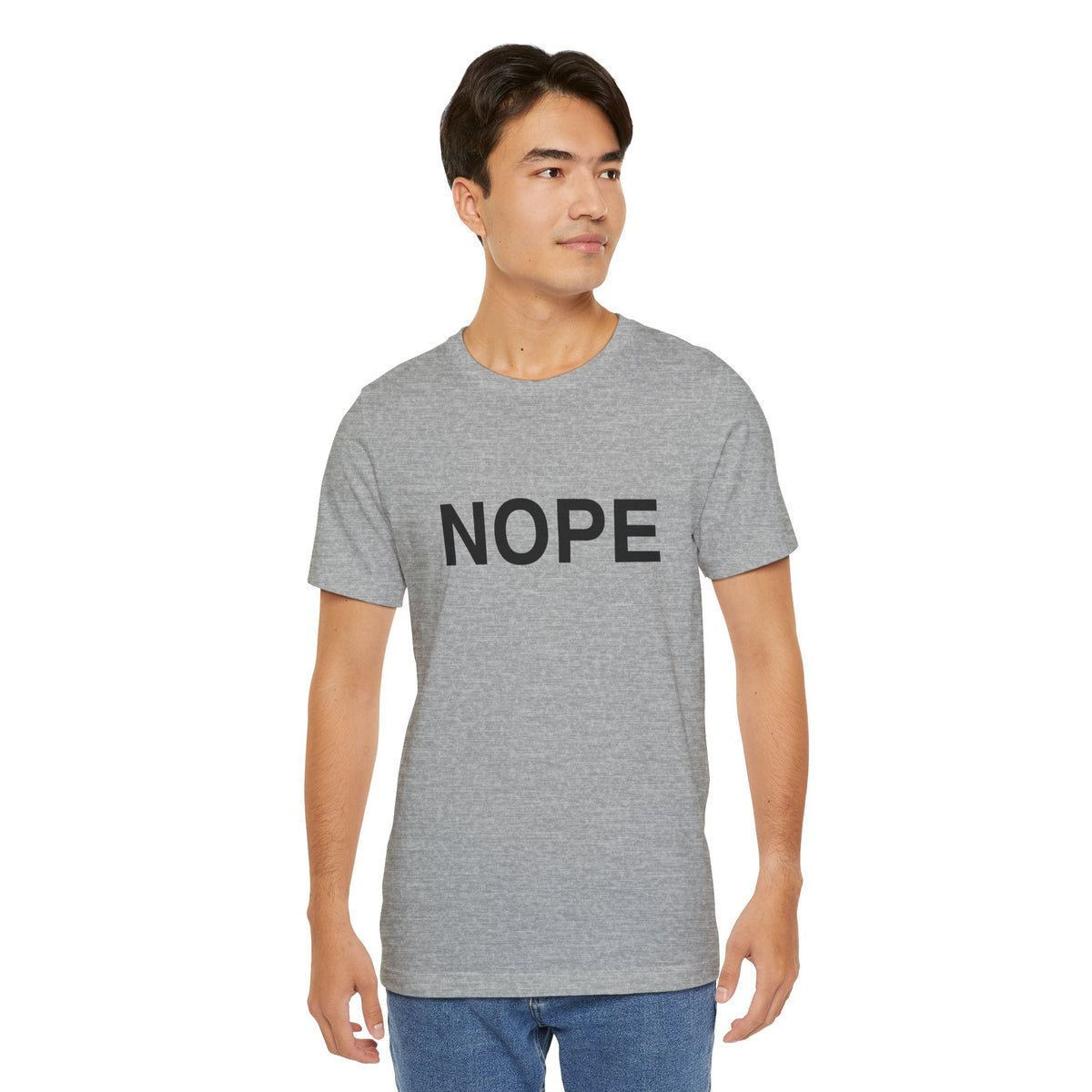 A man wearing a heather gray crewneck t-shirt with 'NOPE' printed in black text across the chest, set against a plain white background.