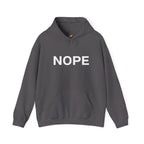 A charcoal gray pullover hoodie with the word 'NOPE' printed in bold white capital letters across the chest on a solid white background.