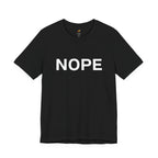 A black short-sleeve crewneck t-shirt with the word 'NOPE' printed in bold white capital letters across the chest, displayed on a clean white background.