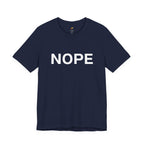 A navy blue short-sleeve crewneck t-shirt with the word 'NOPE' printed in bold white capital letters across the chest, displayed on a clean white background.
